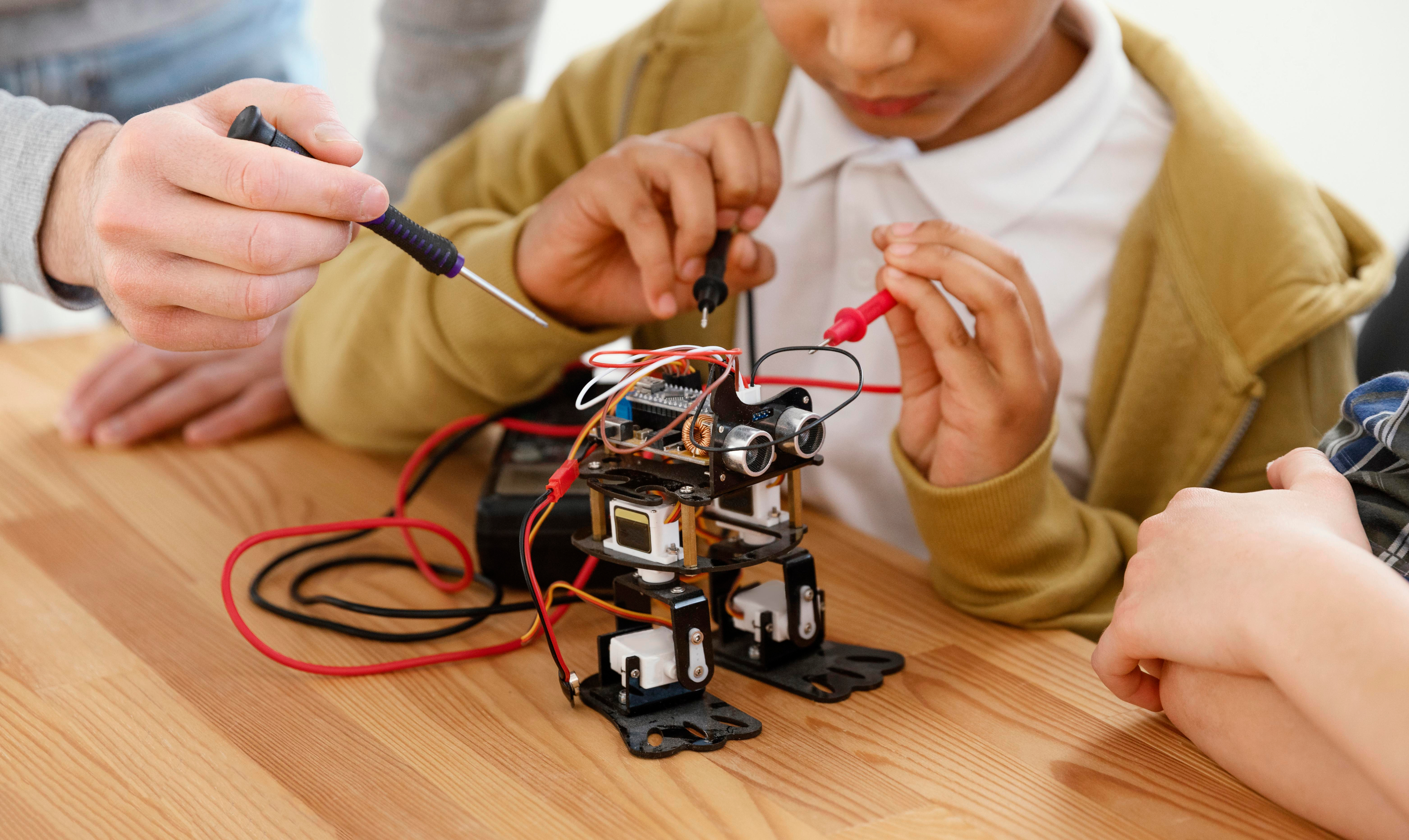 Student soldering a circuit board